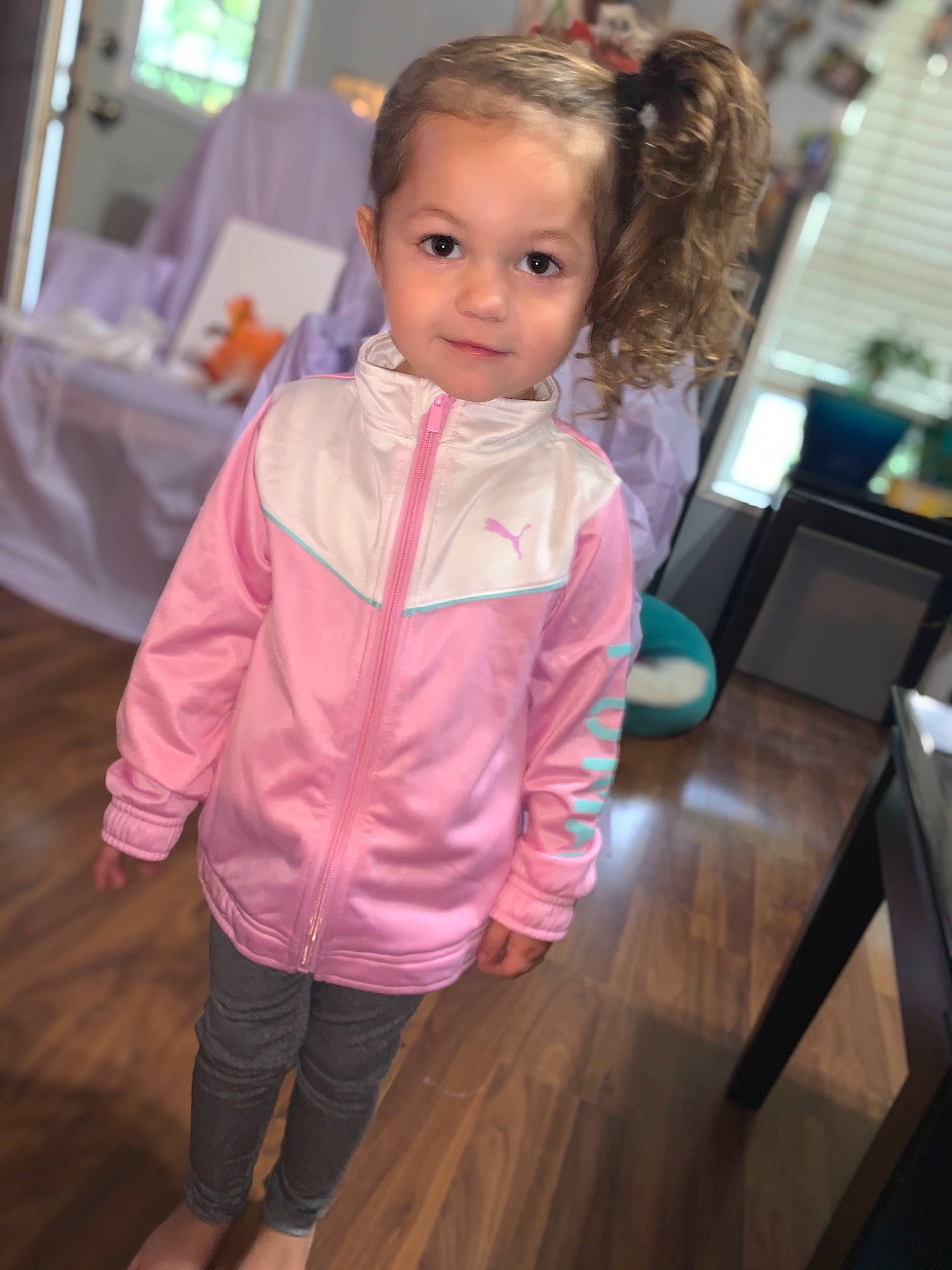 Emmalynn joined the competition — help win amazing prizes! baby_toddler_clothing, blond, brown_hair, cheek, child, eyebrow, flooring, fun, happy, hardwood, iris, magenta, person, room, sitting, sleeve, toddler, varnish, wood, wood_flooring