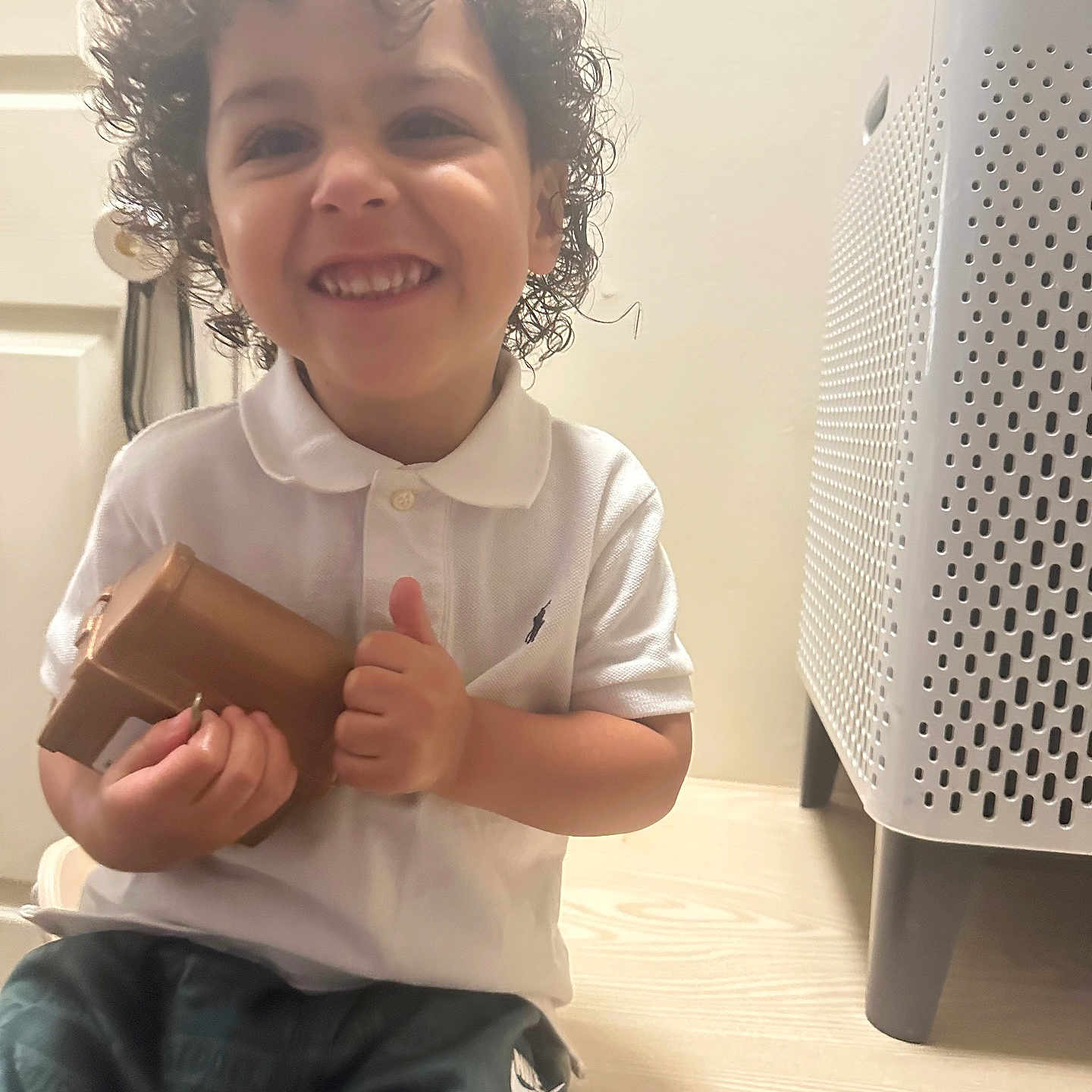 Kingston is registered to the contest to win money with this photo: baby, babylaughing, bodypart, bottle, clothing, curlyhair, face, finger, furniture, hair, hand, happy, head, person, photography, portrait, shaker, sitting, sleeve, smile