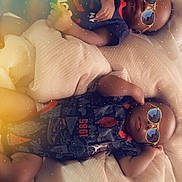 Brandon N Braxton joined the competition — help win amazing prizes! baby, infant, sunglasses, blanket, bed, sleeping, clothing, pacifier, cool, cute, child, indoors, relaxing, two_children, toddler, laying_down, soft_light, cozy, portrait, fashion