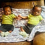 Brandon N Braxton joined the competition — help win amazing prizes! baby, twins, green_shirt, shorts, blanket, stars, couch, hand_holding, infant, cute, sitting, footwear, knitted_booties, indoor, portrait, people, child, two_children, expression, cozy