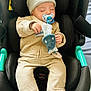 baby, beige_jacket, beige_pants, black_car_seat, car_seat, child, clothing, comfort, cute, hat, indoor, infant, pacifier, peaceful, plush_toy, resting, sleeping, small_hands, soft_toy, turquoise