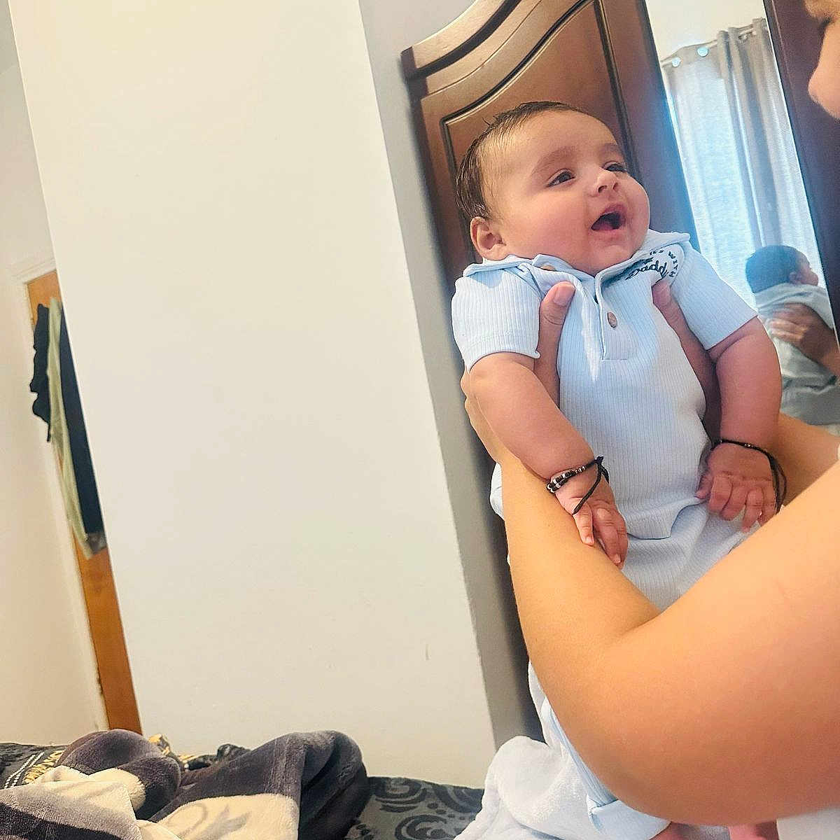 Yuvan joined the competition — help win amazing prizes! arm, baby, bed, blanket, child, clothing, curtain, cute, hand, happy, holding, indoor, infant, mirror, person, portrait, reflection, room, smile, wooden_furniture