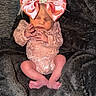 Blakeleigh joined the competition — help win amazing prizes! newborn, baby, infant, sleeping, pink_bow, lace_outfit, blanket, soft_texture, cute, peaceful, small_hands, small_feet, indoors, portrait, cozy, resting, child, adorable, headwear, wrapped