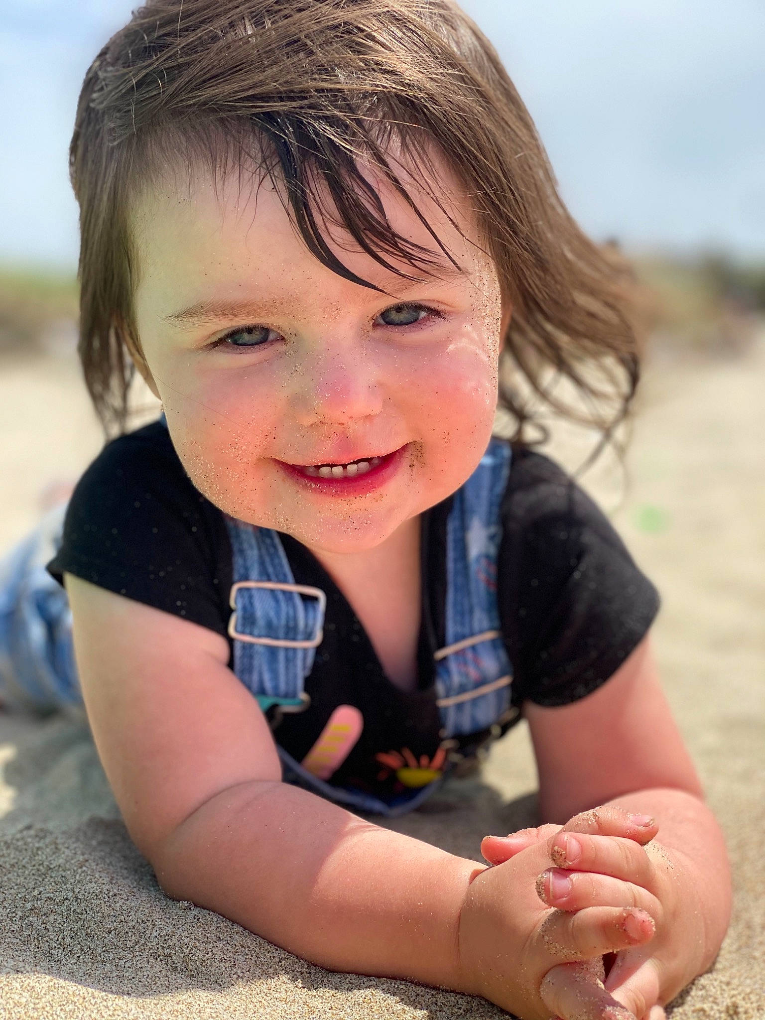 Kynslee is registered to the contest to win money with this photo: beach, blond, child, eye, face, facial_expression, finger, fun, hand, happy, joy, laugh, person, photography, play, sand, sitting, skin, smile, summer