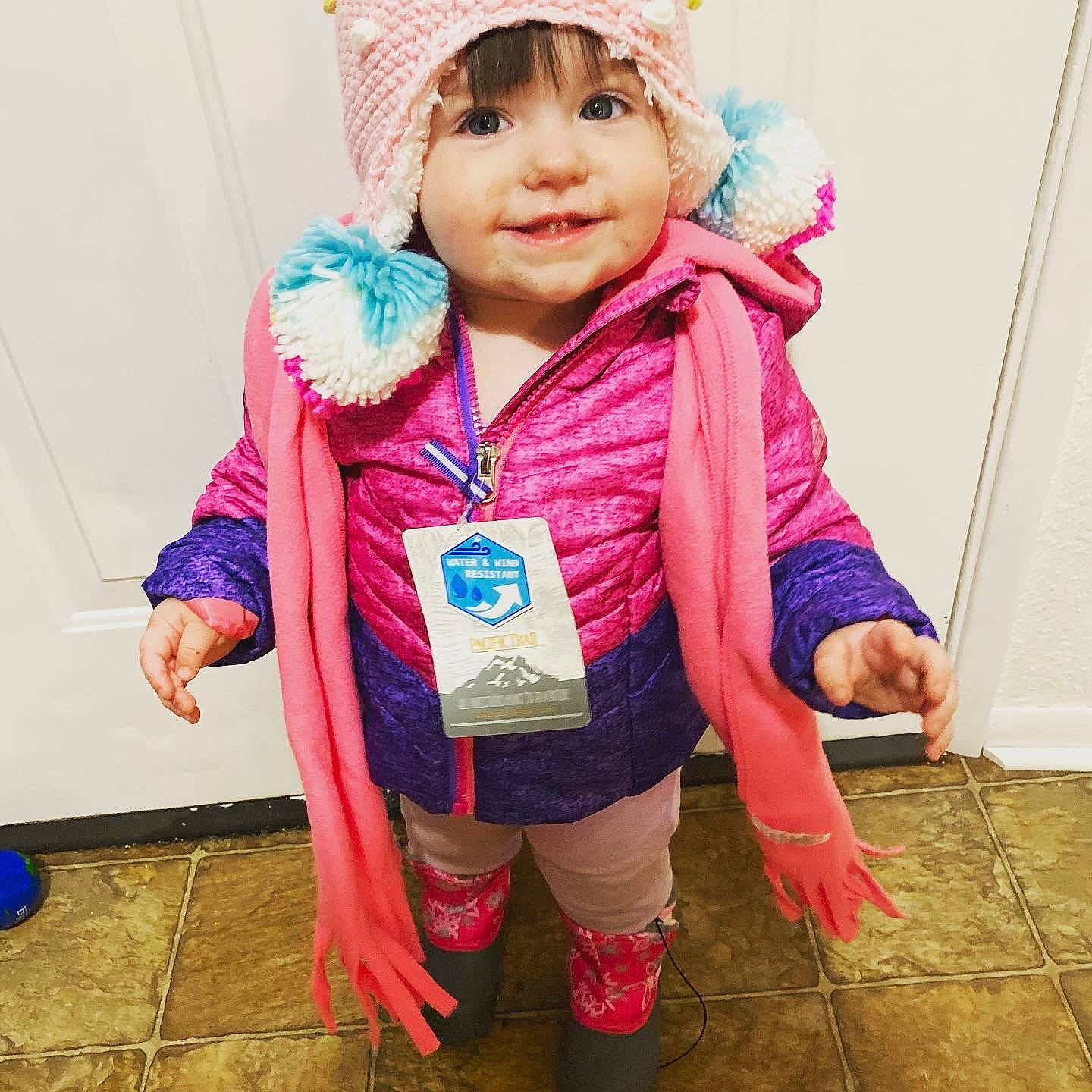Kynslee is registered to the contest to win money with this photo: blue, cheek, child, child_model, clothing, cool, ear, eye, face, fashion, head, headgear, headwear, hood, jacket, outerwear, person, pink, purple, skin