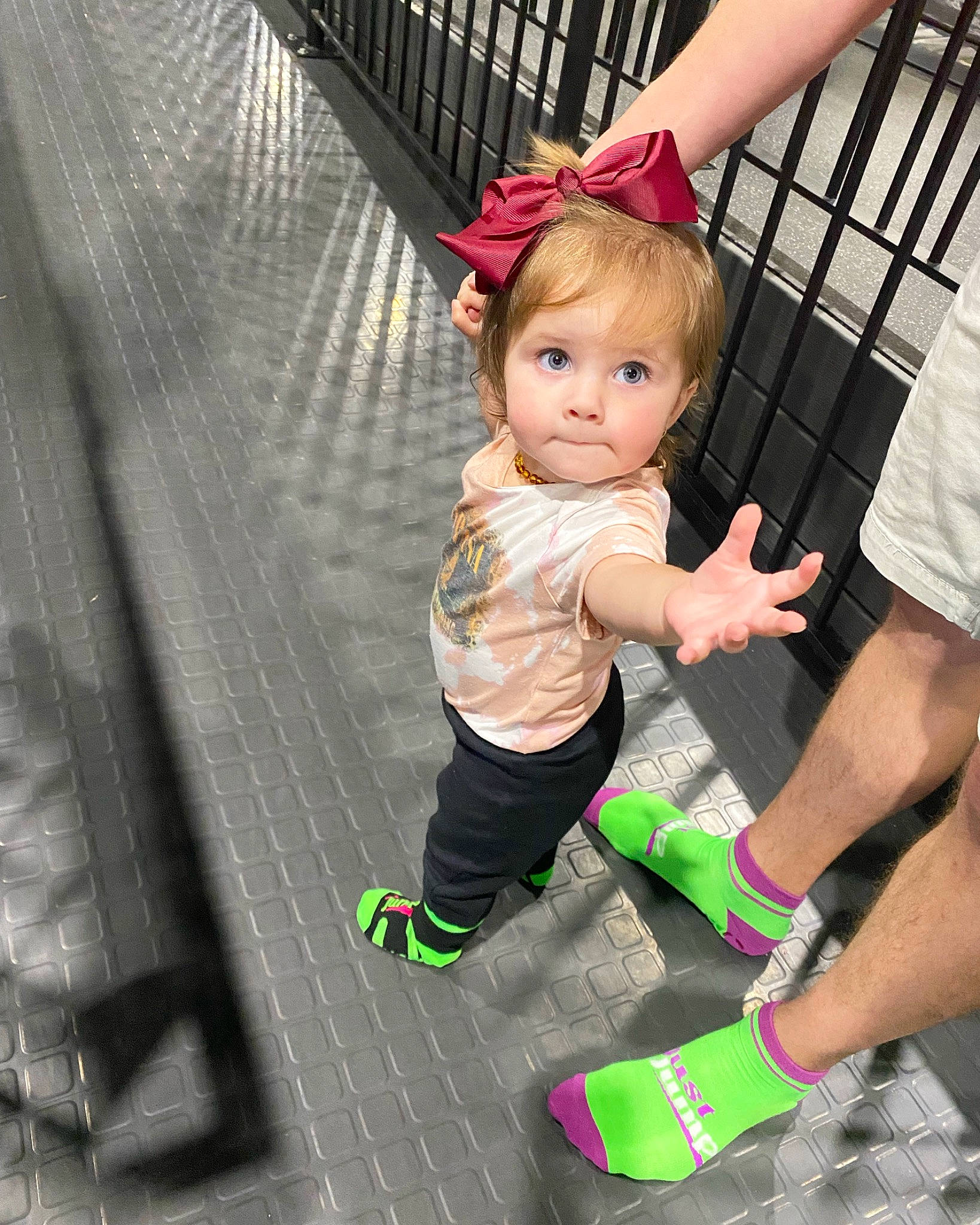 Lorelai joined the competition — help win amazing prizes! baby, baby_toddler_clothing, child, flooring, fun, gesture, happy, human_leg, leg, leisure, magenta, person, pink, play, sandal, shorts, sitting, sock, thigh, thumb