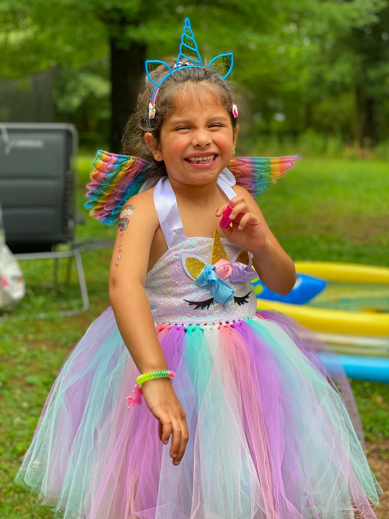 Dakota is registered to the contest to win money with this photo: ballet_tutu, beauty, entertainment, event, face, fun, grass, green, happy, headgear, headpiece, joy, leisure, magenta, performing_arts, person, pink, plant, purple, smile