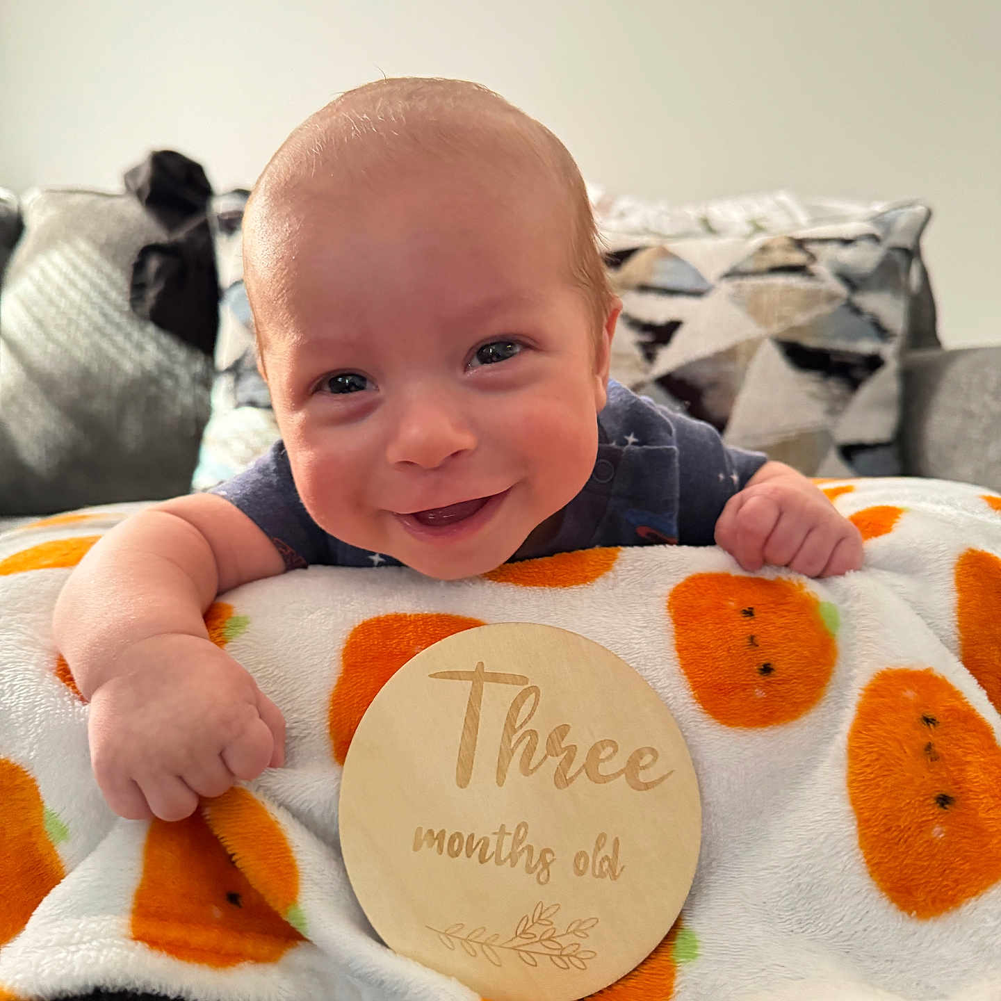 Elijah is registered to the contest to win money with this photo: baby, babylaughing, blanket, bodypart, couch, cushion, face, finger, furniture, hand, happy, head, homedecor, laughing, newborn, person, photography, portrait, quilt, smile