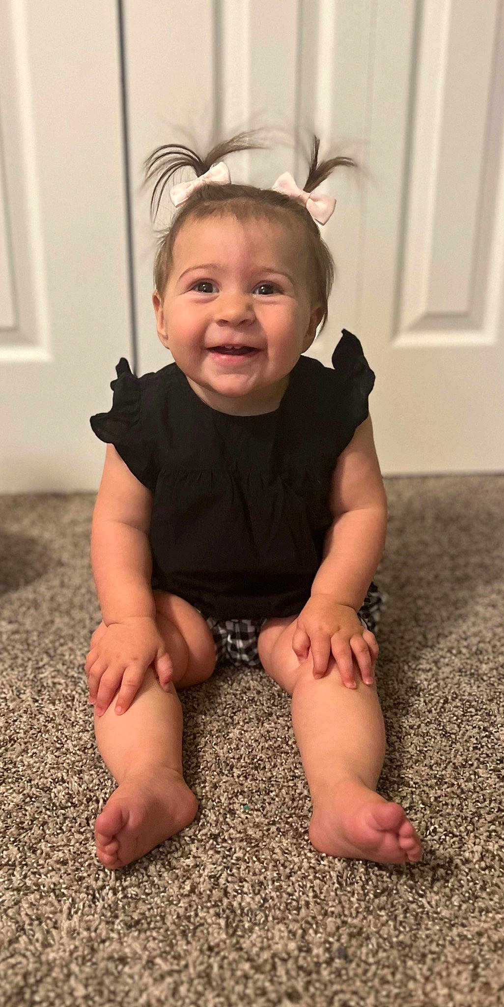 Evelyn is registered to the contest to win money with this photo: baby, baby_toddler_clothing, cheek, chin, eye, face, finger, floor, flooring, happy, head, human_body, iris, joy, knee, person, shoulder, skin, sleeve, smile