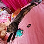 bed, blanket, cat, cozy, curtain, domestic_cat, furniture, indoor, pet, pink_bedspread, pink_curtain, plush_toy, relaxed, resting, room, sleeping_cat, striped_cat, stuffed_toy, tabby_cat, toy