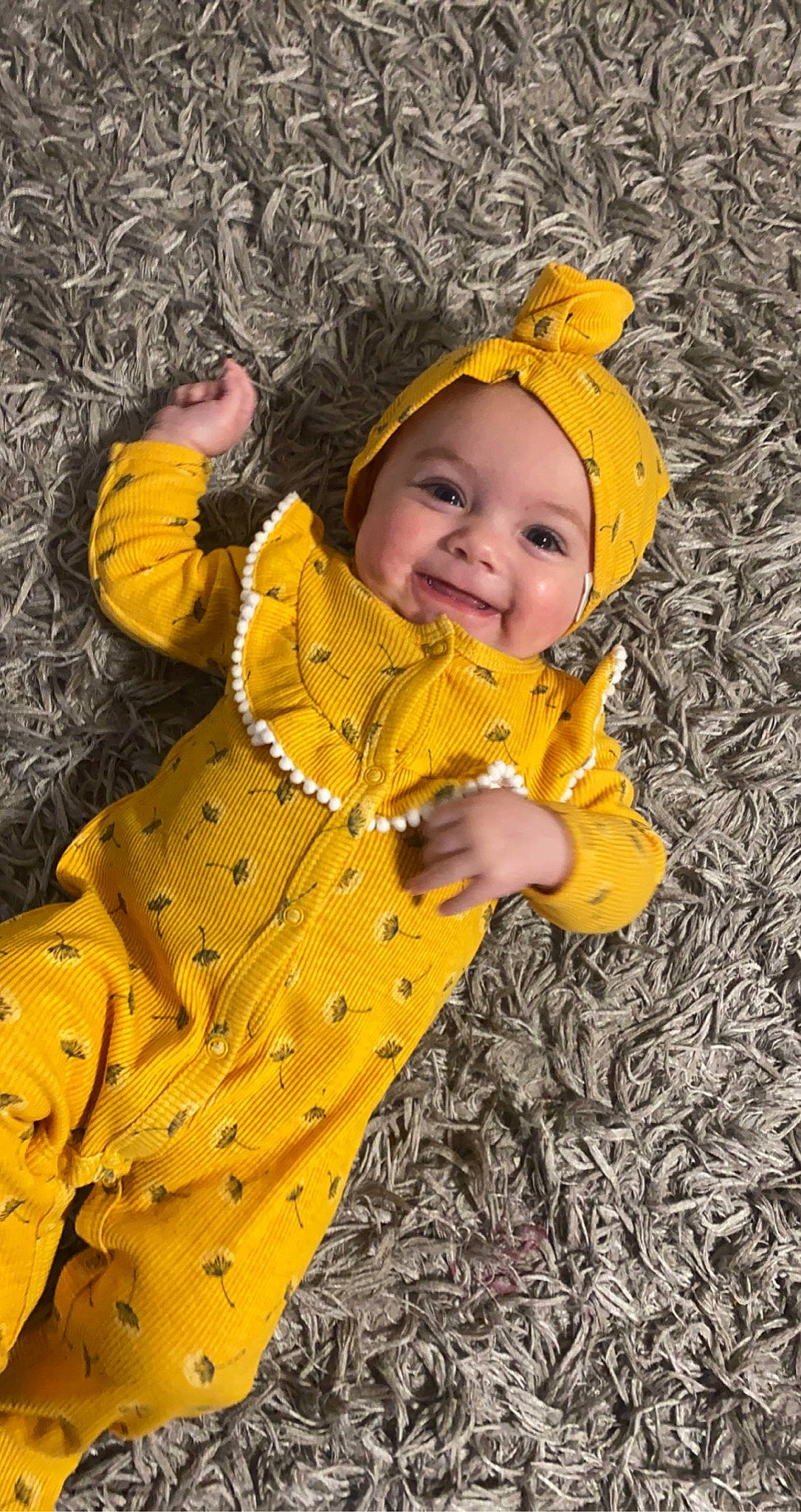 Hanna is registered to the contest to win money with this photo: adaptation, baby, baby_toddler_clothing, eye, face, gesture, grass, happy, headwear, human_body, jacket, joy, leaf, outerwear, people_in_nature, person, plant, smile, toddler, tree