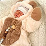 Jules participe au concours pour gagner de l'argent avec cette photo : baby, infant, sleeping, fluffy_suit, bear_costume, mittens, hat, blanket, soft_texture, pacifier_clip, wooden_beads, cute, cozy, child, newborn, indoors, resting, warm, adorable, portrait