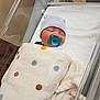 Kyren joined the competition — help win amazing prizes! baby, newborn, infant, pacifier, hospital_bassinet, bassinet, blanket, polka_dot_blanket, swaddle, beanie, striped_hat, sleeping, hospital, medical, crib, bedding, timestamp, date_stamp, cozy, cute