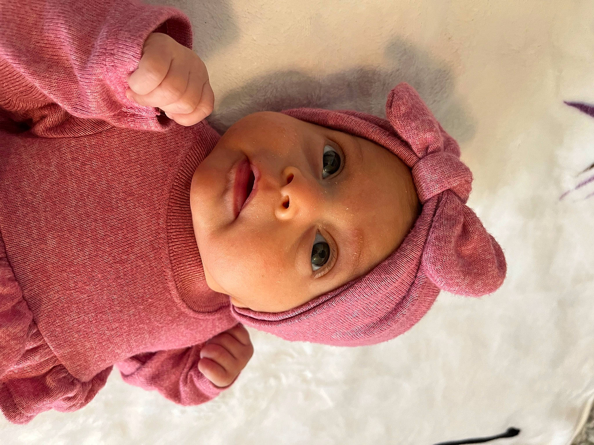 Ella is registered to the contest to win money with this photo: baby, baby_toddler_clothing, cheek, ear, eye, eyebrow, eyelash, face, facial_expression, headwear, iris, lip, mouth, nose, outerwear, person, pink, product, skin, sleeve