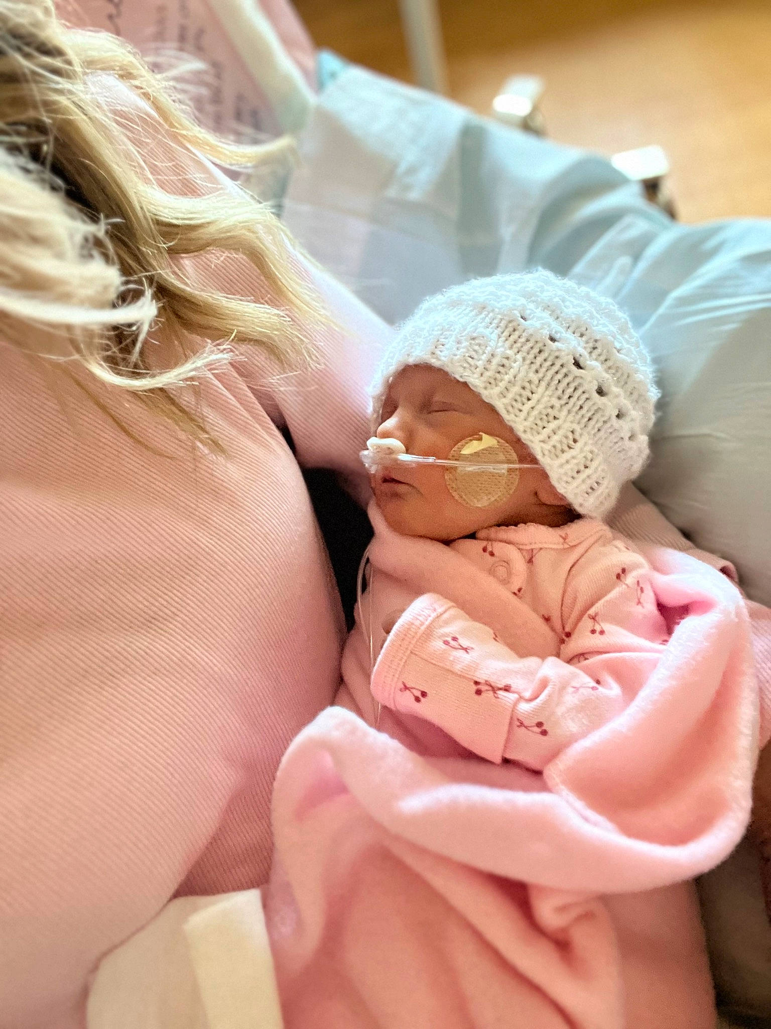 Selah is registered to the contest to win money with this photo: abdomen, baby, baby_sleeping, cap, child, comfort, gesture, glasses, hand, happy, headgear, headwear, human, human_leg, knee, linens, person, skin, textile, thigh