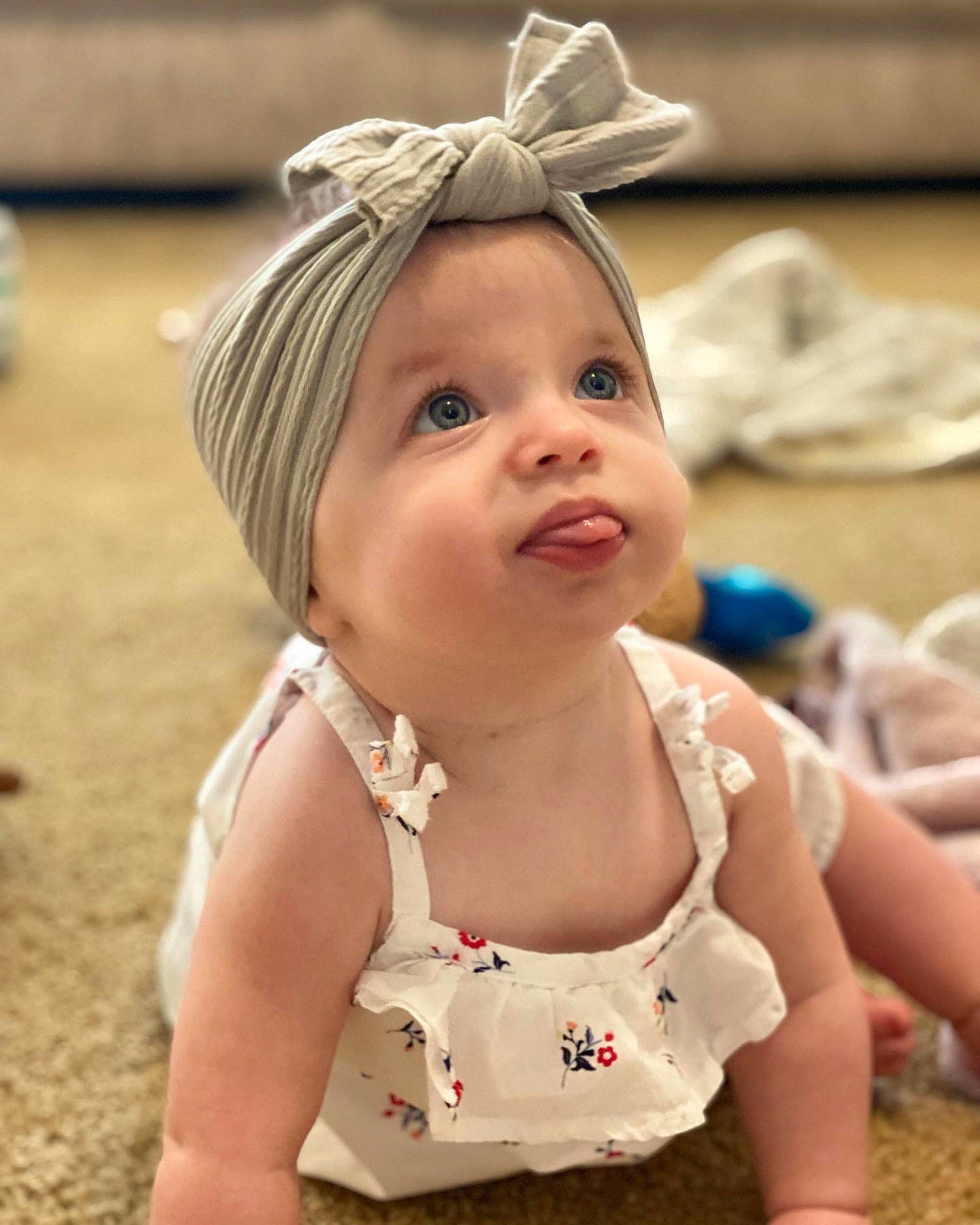 Sparkle is registered to the contest to win money with this photo: baby, baby_toddler_clothing, blond, cap, clothing, fun, grass, happy, headband, headpiece, iris, jewellery, lip, neck, necklace, person, pink, skin, smile, toddler