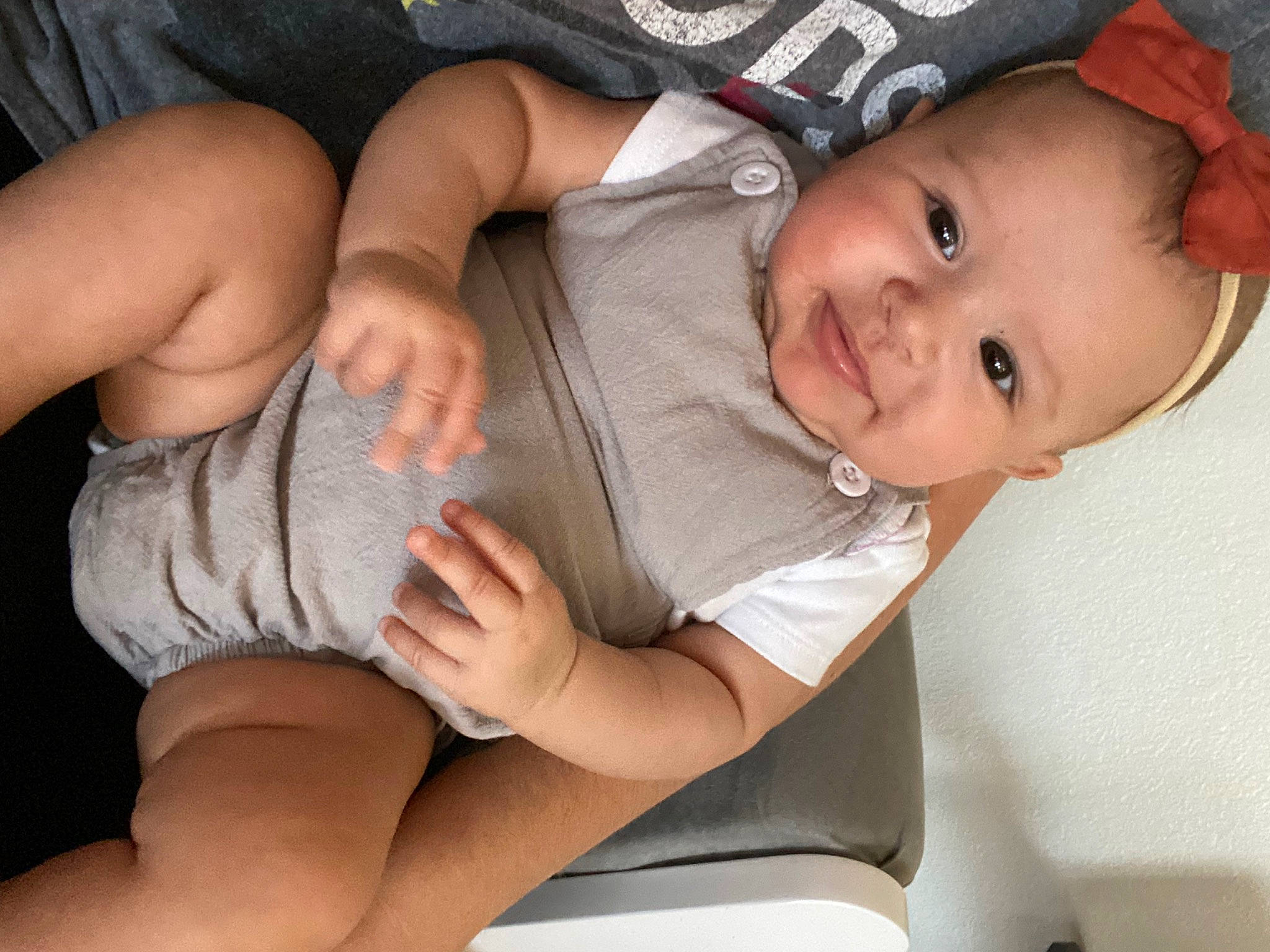 Gracelynn is registered to the contest to win money with this photo: baby, baby_toddler_clothing, chest, comfort, elbow, eye, facial_expression, finger, gesture, hand, head, joint, knee, leg, mouth, person, skin, smile, thigh, thumb