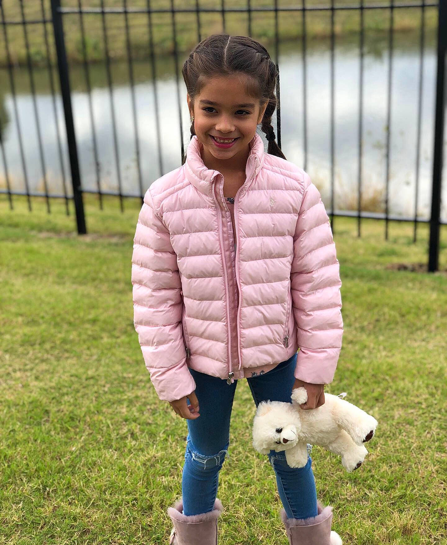 Priscilla is registered to the contest to win money with this photo: child, fawn, footwear, grass, jacket, joy, leg, outerwear, person, play, shoe, sleeve, textile, toddler, wool