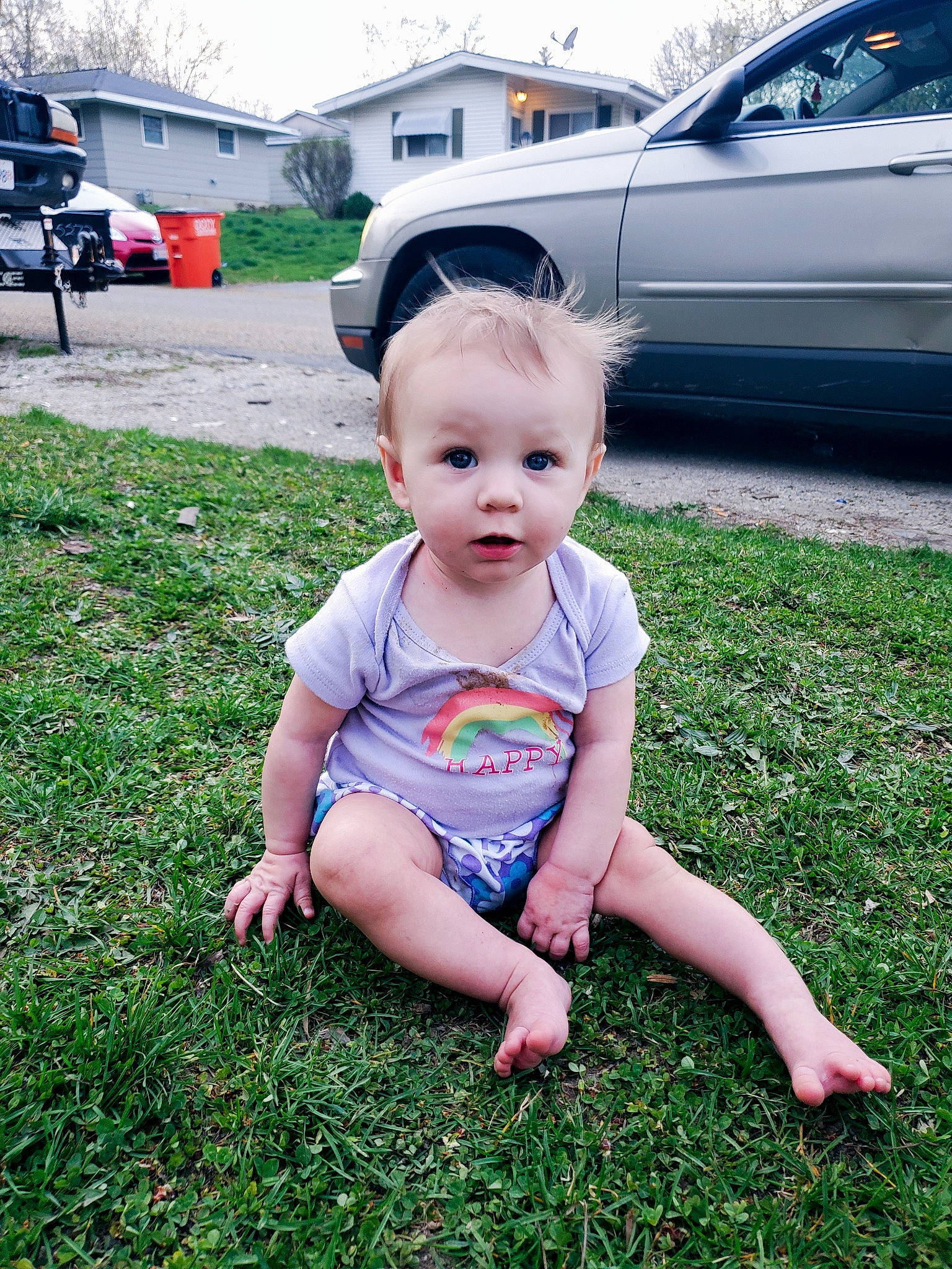 Kora is registered to the contest to win money with this photo: baby, baby_toddler_clothing, car, child, face, grass, happy, lawn, mammal, people_in_nature, person, plant, recreation, summer, tire, toddler, tree, vehicle, vehicle_door, wheel