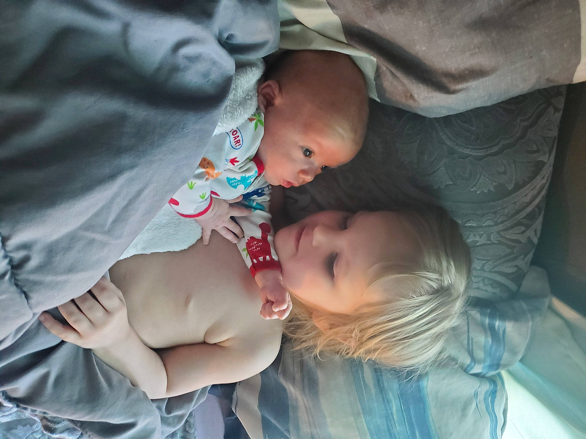 Dustin is registered to the contest to win money with this photo: arm, baby, baby_products, baby_toddler_clothing, cheek, child, comfort, ear, fun, gesture, grass, happy, lip, mouth, nail, person, sitting, skin, smile, toddler