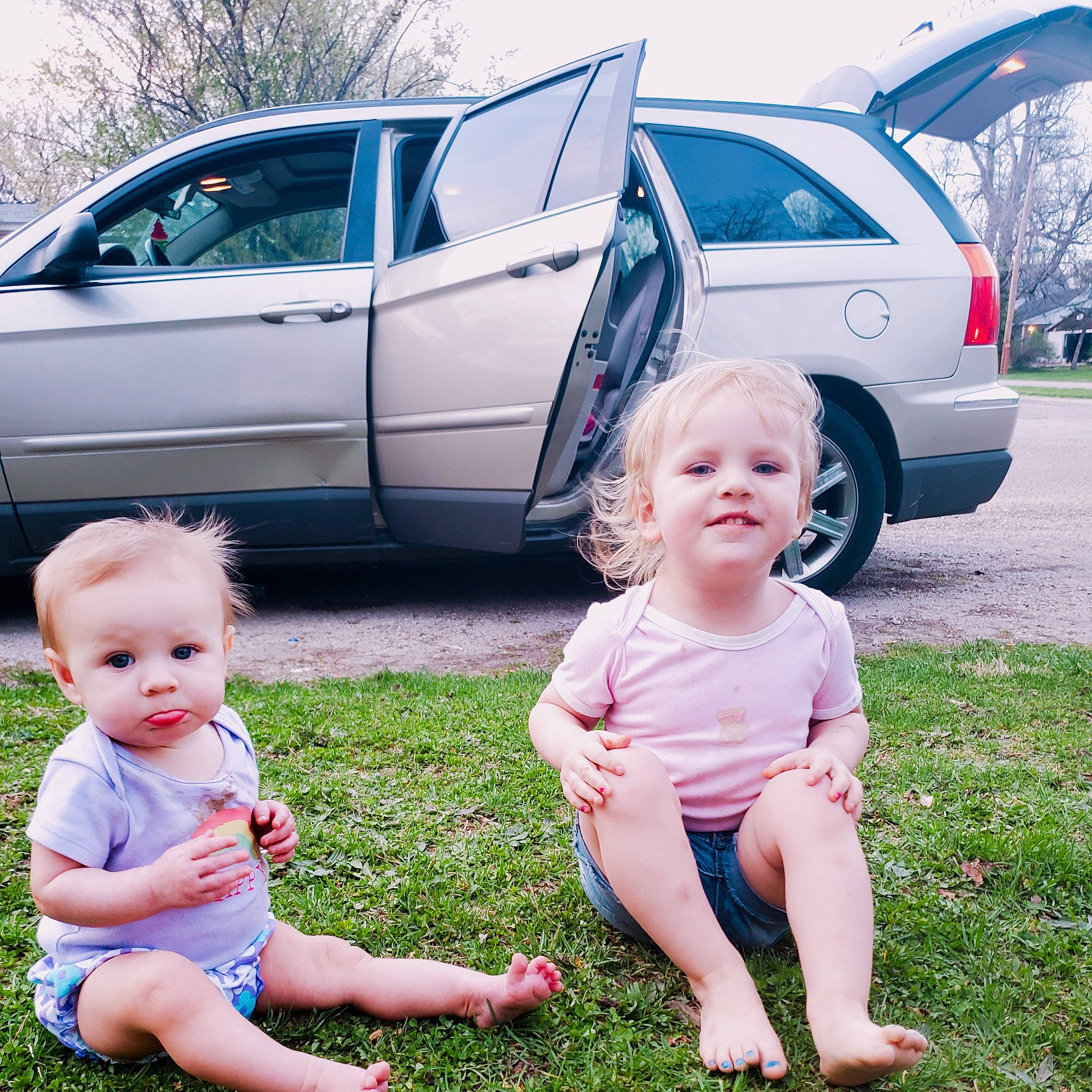 Arison is registered to the contest to win money with this photo: alloy_wheel, automotive_design, automotive_exterior, automotive_tire, car, grass, happy, joy, land_vehicle, leg, morning, motor_vehicle, person, photograph, plant, product, tire, toddler, tree, vehicle