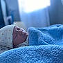 Tayvin joined the competition — help win amazing prizes! baby, bed, bedding, blanket_texture, blue_blanket, cheeks, closed_eyes, cozy, hat, infant, mouth, newborn, nose, nursery, peaceful, pillow, portrait, shallow_depth_of_field, sleeping, soft_light