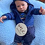 Tayvin joined the competition — help win amazing prizes! baby, blanket, blue_hoodie, cozy, cute, denim_pants, expression, hood, indoors, infant, lying_down, milestone, newborn, one_month, pillow, portrait, small_hand, soft_texture, striped_socks, wooden_sign
