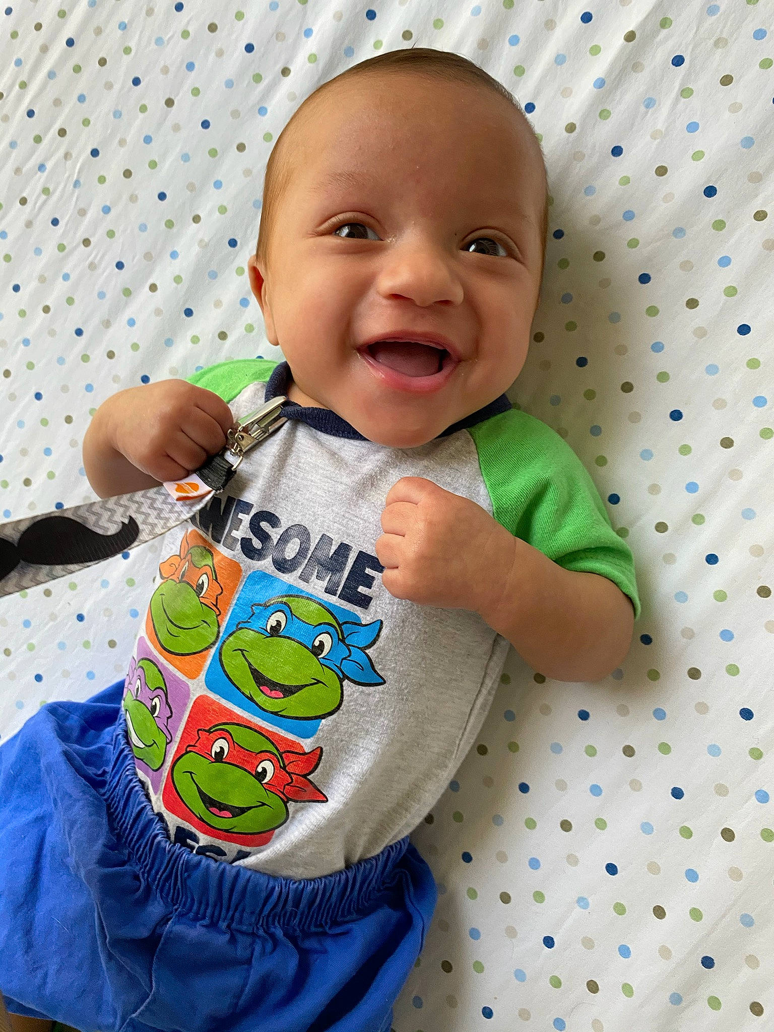 Jakobe is registered to the contest to win money with this photo: baby, baby_products, baby_toddler_clothing, baby_toys, child, happy, person, play, product, skin, sleeve, smile, t_shirt, toddler