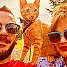 Little Sir Lucifer is registered to the contest to win money with this photo: beard, cat, daylight, floral_shirt, greenery, happy, leisure, man, nature, orange_cat, outdoor, people, pet, portrait, red_shirt, shoulder, smile, sunglasses, sunny, woman