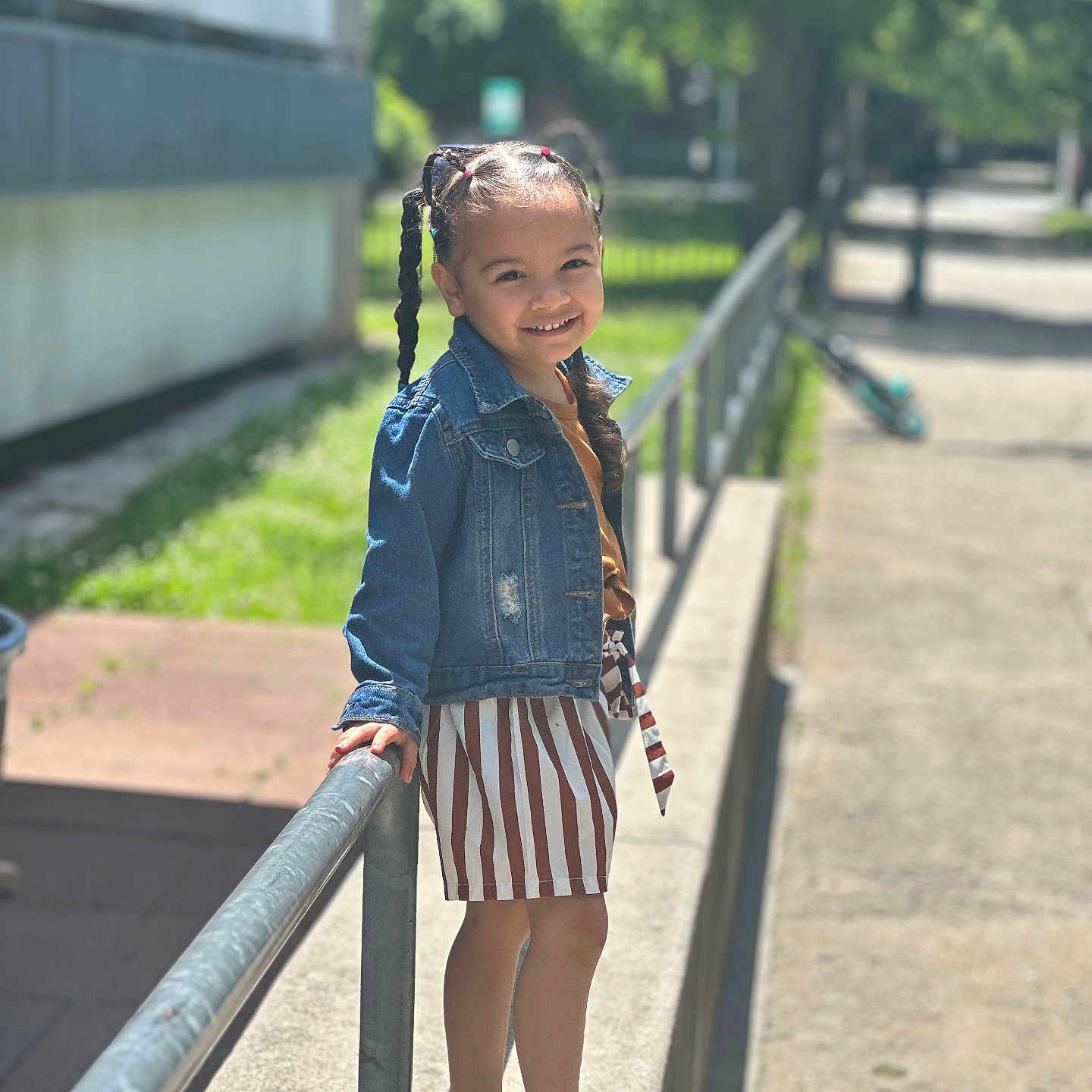 Nialee joined the competition — help win amazing prizes! braid, child, clothing, face, female, footwear, girl, hair, handrail, happy, head, jeans, pants, person, sandal, shorts, sitting, sleeve, smile, standing
