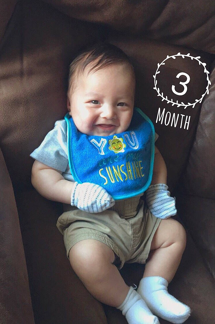 Kacen is registered to the contest to win money with this photo: baby, baby_products, baby_toddler_clothing, blue, cheek, child, cool, leg, person, product, sitting, skin, sleeve, t_shirt, toddler