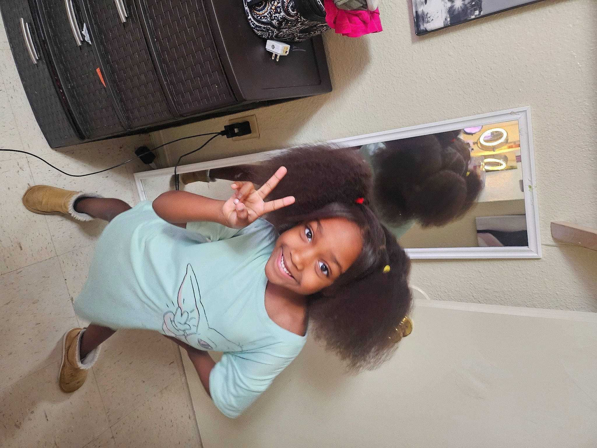 Harmony is registered to the contest to win money with this photo: audio_equipment, automotive_design, child, comfort, computer_component, computer_hardware, elbow, electronic_instrument, flooring, fun, happy, human_leg, joy, knee, person, picture_frame, room, smile, sportswear, t_shirt