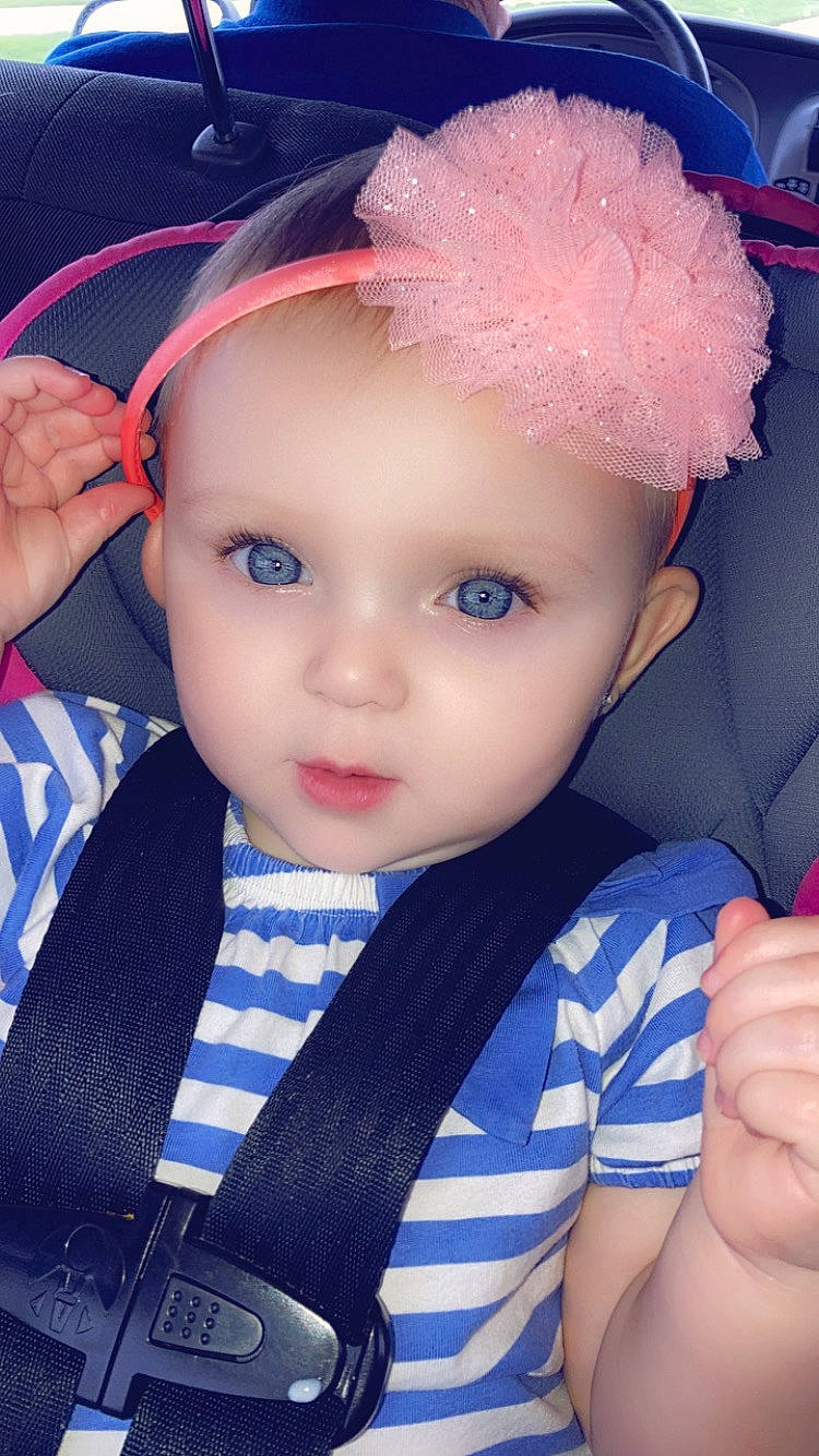 Keziah is registered to the contest to win money with this photo: baby_toddler_clothing, black_hair, blue, cheek, chin, cool, electric_blue, eyebrow, eyelash, flash_photography, happy, headband, headgear, headpiece, headwear, human, iris, lip, person, skin