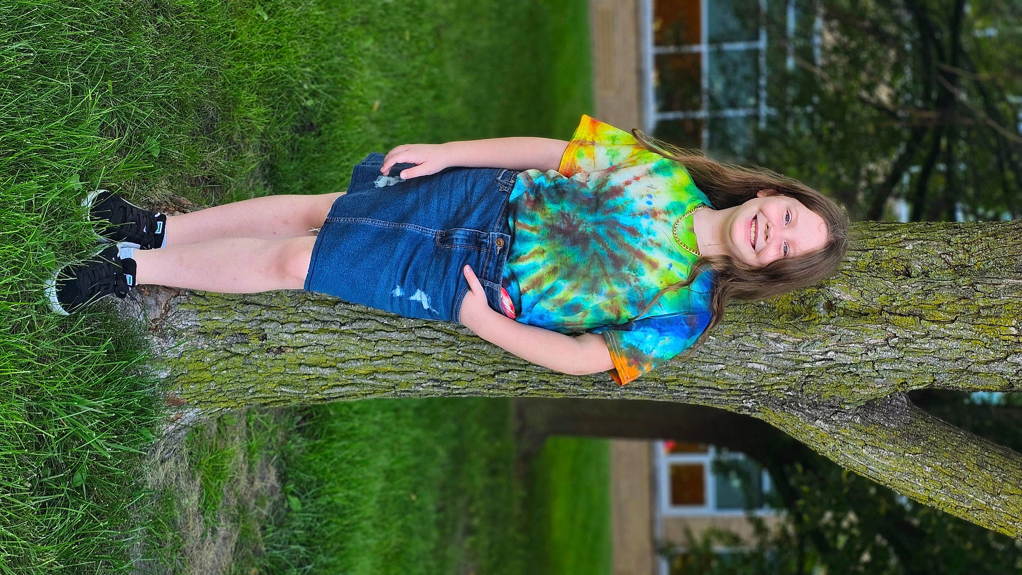 Krista is registered to the contest to win money with this photo: beauty, child, denim, electric_blue, fashion, fun, grass, green, happy, jeans, joy, lawn, leaf, leisure, people_in_nature, person, plant, sitting, t_shirt, textile