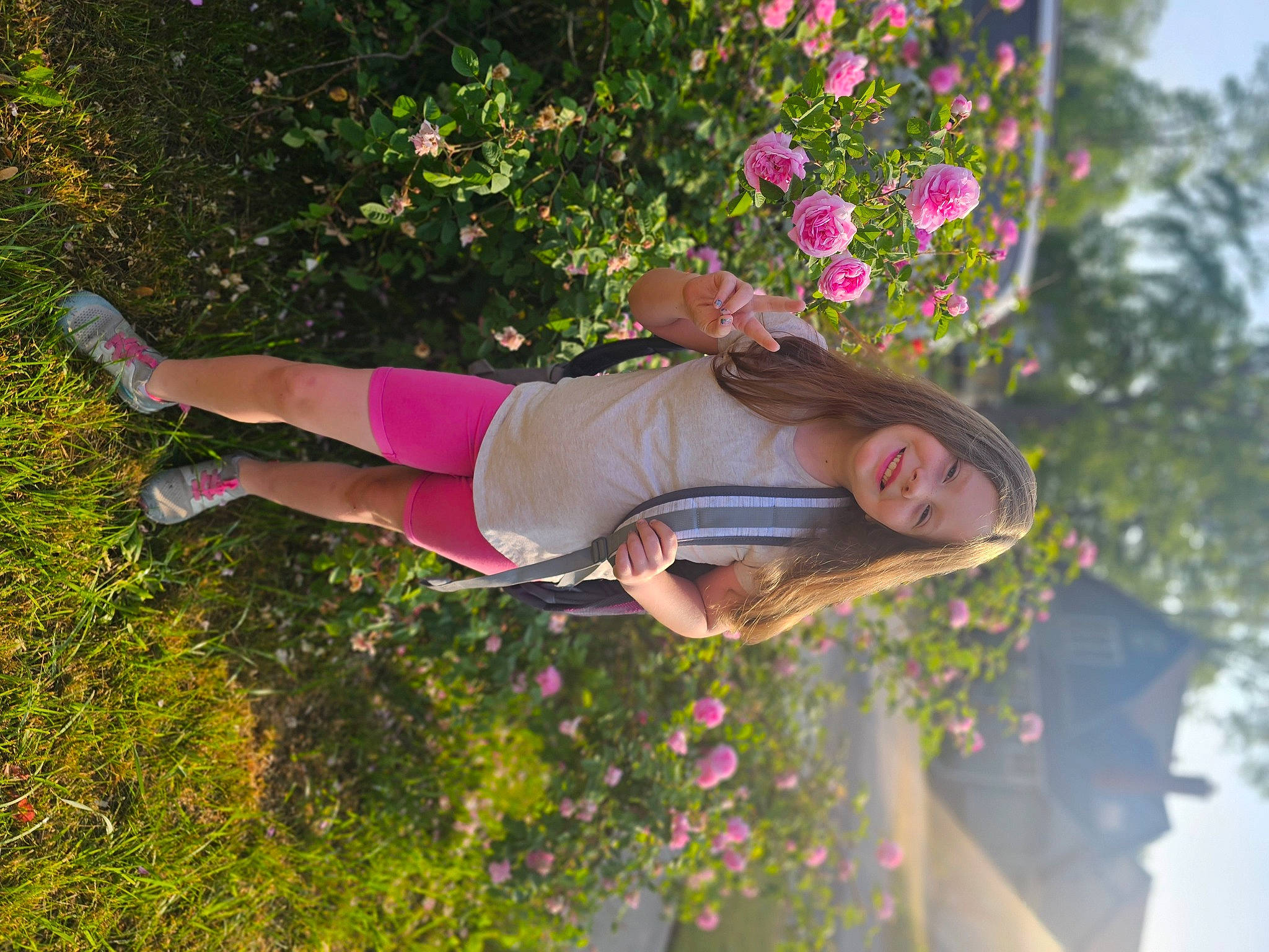 Krista joined the competition — help win amazing prizes! flower, fun, garden, grass, happy, hat, joy, leisure, magenta, people_in_nature, person, petal, pink, plant, recreation, shorts, shrub, sky, smile, t_shirt
