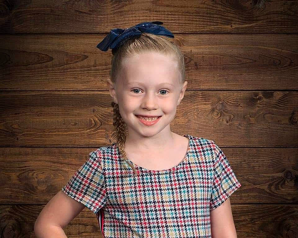 Evelyn joined the competition — help win amazing prizes! blue, child, chin, facial_expression, flash_photography, fun, hairstyle, happy, head, iris, joy, neck, pattern, person, plaid, shoulder, sleeve, smile, standing, tartan