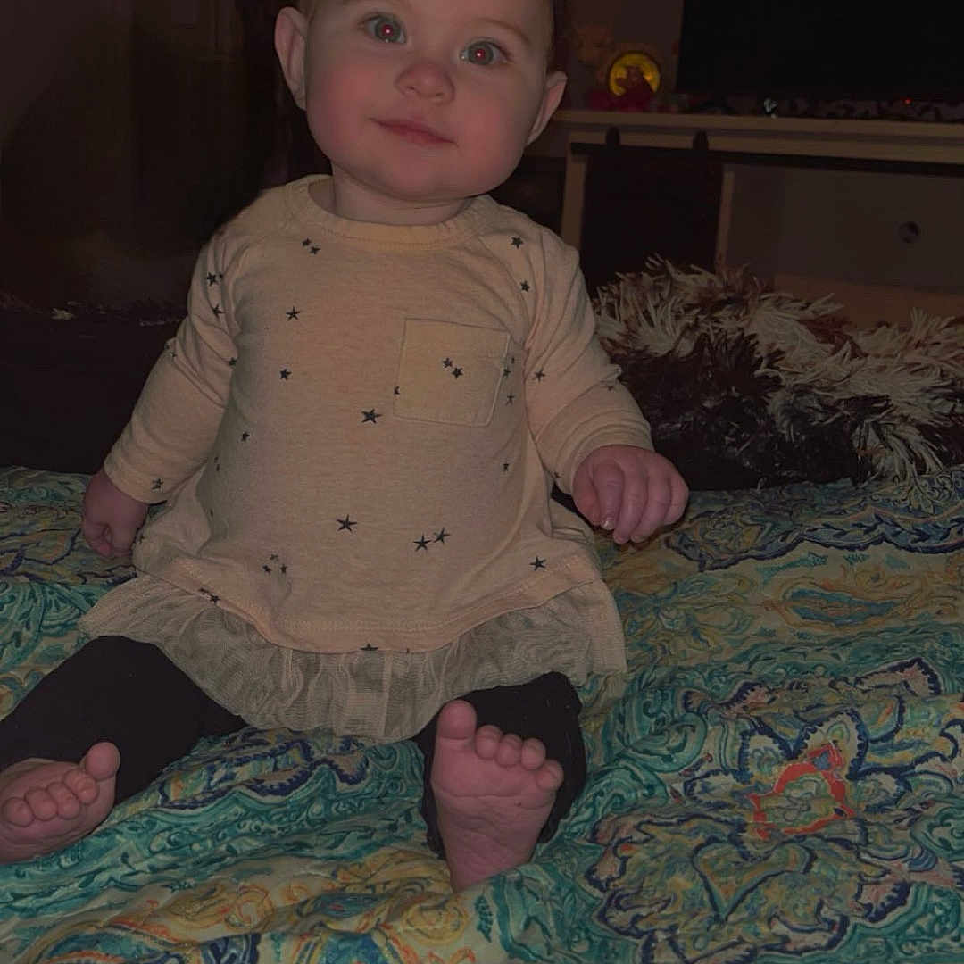 Lovelynn is registered to the contest to win money with this photo: baby, bed, bedroom, bodypart, clothing, couch, cushion, face, finger, furniture, hand, head, homedecor, indoors, pants, person, photography, portrait, room, sitting