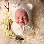 Hallie joined the competition — help win amazing prizes! newborn, baby, infant, smiling, sleeping, white, knit_hat, bear_ears, flowers, soft_texture, fluffy, portrait, cute, cozy, wrapped, closeup, peaceful, decorative, innocent, tender