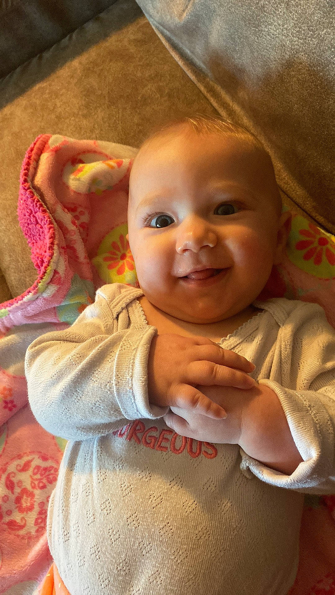 Analeah is registered to the contest to win money with this photo: baby, cheek, chin, dress, ear, eye, eyebrow, forehead, gesture, happy, head, iris, lip, mouth, nose, person, product, skin, sleeve, smile