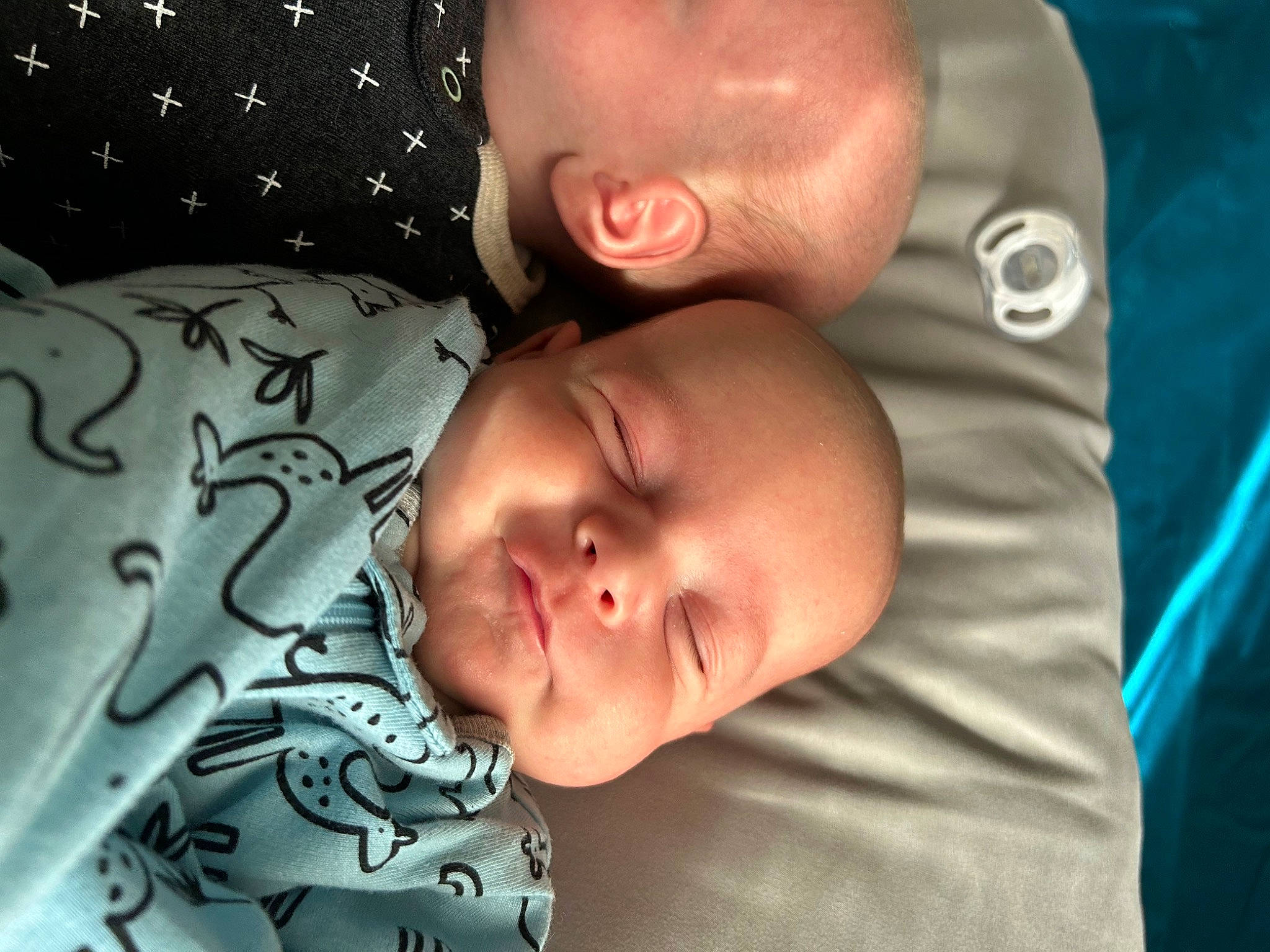 Eugene is registered to the contest to win money with this photo: baby, baby_toddler_clothing, bedtime, cheek, child, chin, close_up, comfort, eye, eyebrow, finger, forehead, fun, happy, linens, mouth, nose, person, room, skin