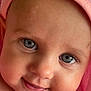 baby, close_up, face, smiling, blue_eyes, drool, pink_towel, skin, infant, cute, child, portrait, soft_texture, happy, cheeks, head, eyelashes, innocence, warmth, toddler