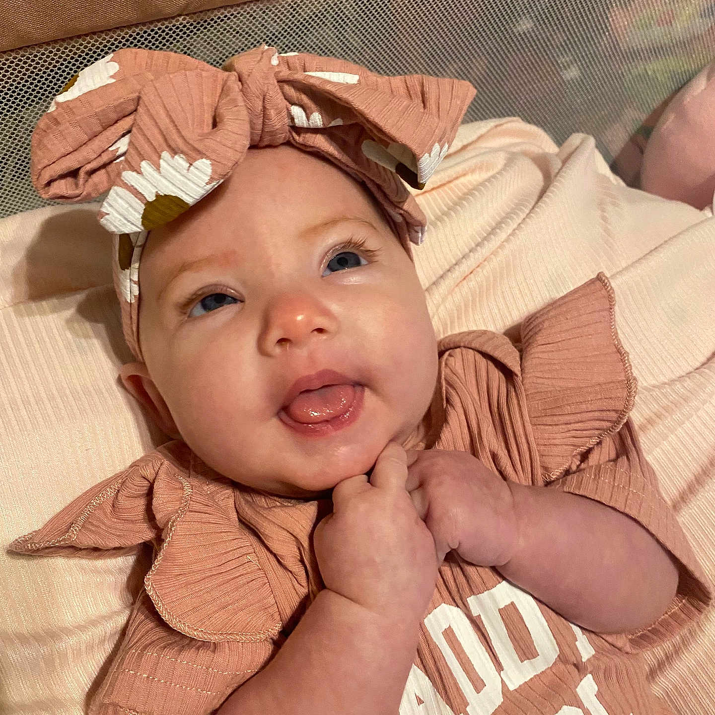 Maddie joined the competition — help win amazing prizes! baby, girl, headband, bow, smiling, tongue_out, hands, clothing, ruffles, text, daddys_girl, portrait, cute, infant, closeup, soft_texture, pink, happy, lying_down, indoors