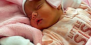 Daleyza joined the competition — help win amazing prizes! baby, bed, blanket, child, clothing, comfort, cozy, cute, headwear, indoors, infant, mittens, newborn, peaceful, pink_bow, portrait, resting, sleep, sleeping, soft