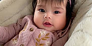 Daleyza joined the competition — help win amazing prizes! baby, blanket, car_seat, child, clothing, cozy, cute, driver, embroidered, face, fluffy, headband, indoors, infant, jacket, man, person, pink_bow, portrait, vehicle
