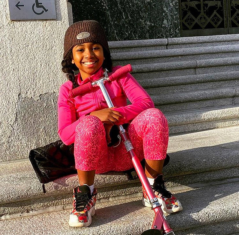 Fatinah joined the competition — help win amazing prizes! cap, child, child_model, cool, fashion, footwear, headgear, headwear, joy, knit_cap, magenta, outerwear, person, photography, pink, shoe, sitting, smile, street_fashion, toddler