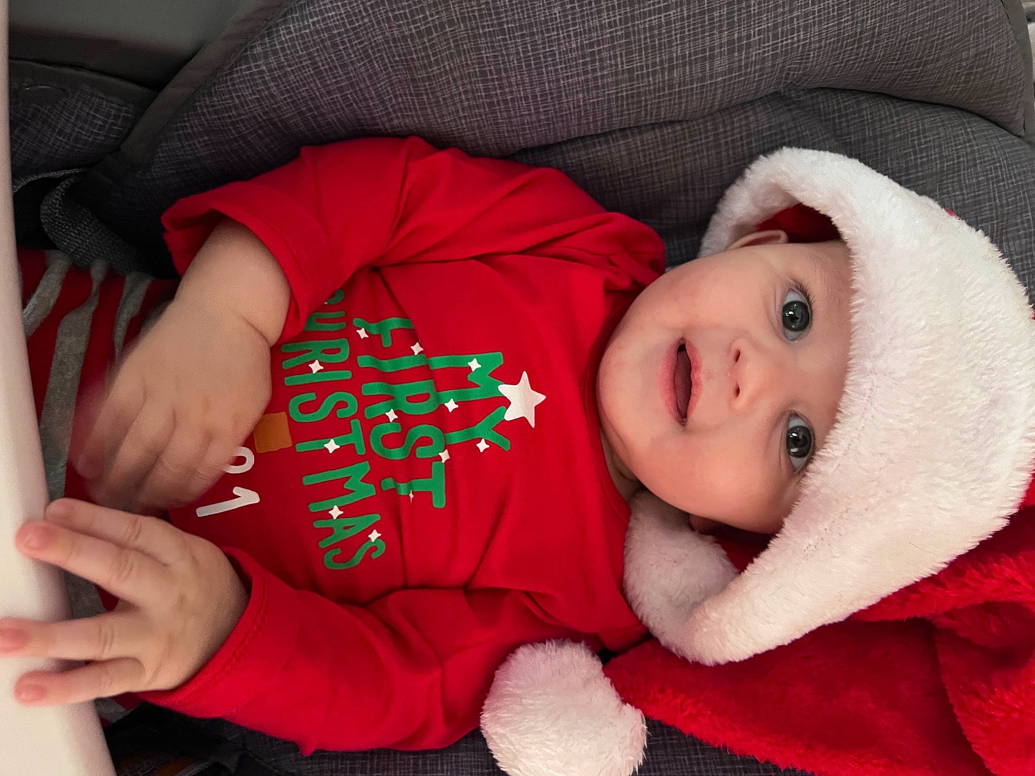 Jason is registered to the contest to win money with this photo: baby, baby_toddler_clothing, cheek, child, clothing, comfort, eye, facial_expression, hat, head, headwear, human_body, lip, mouth, nose, outerwear, person, skin, sleeve, textile