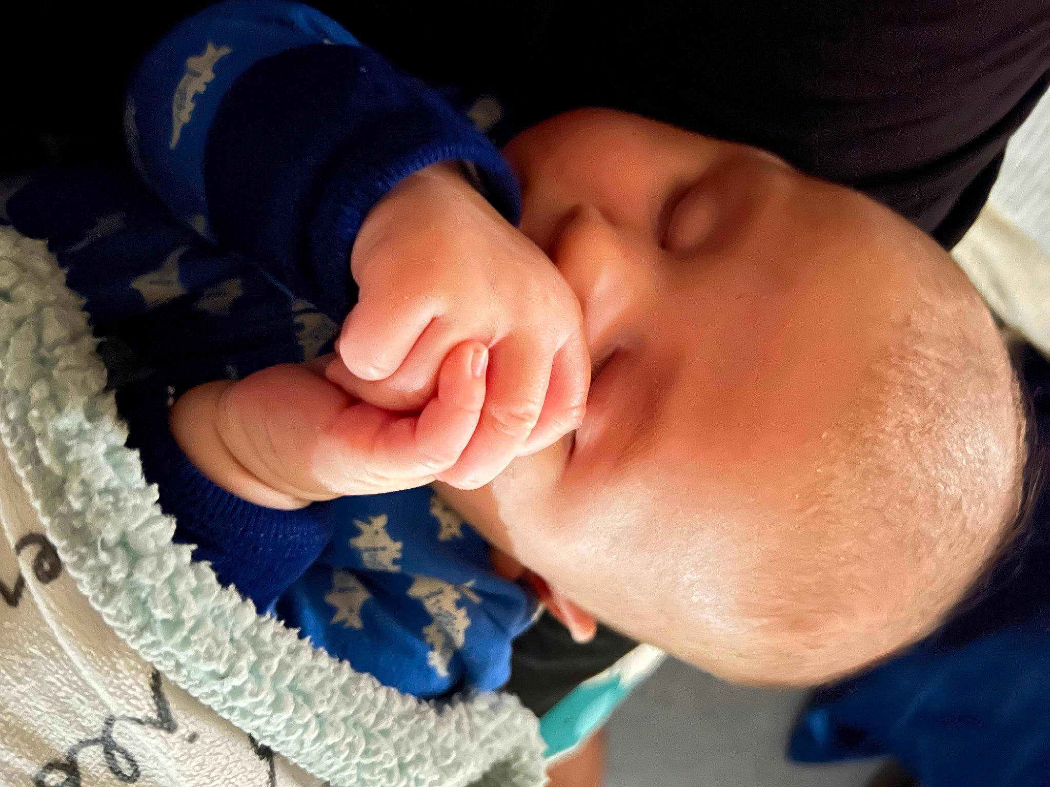 Jason is registered to the contest to win money with this photo: automotive_tire, baby, baby_products, baby_toddler_clothing, blue, child, comfort, elbow, electric_blue, eyelash, fashion_accessory, finger, gesture, hand, headgear, nail, pattern, person, thumb, toddler