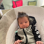 Kainen joined the competition — help win amazing prizes! baby, infant, baby_seat, hoodie, nike, clothing, spiky_hair, hair_style, indoor, fabric, pattern, hand, face, person, cute, relaxing, young_child, comfort, casual, expression