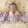 Lydia is registered to the contest to win money with this photo: newborn, baby, sleeping, portrait, headband, floral, blanket, wrapped, swaddled, textile, fluffy, cream, lavender, infant, peaceful, indoors, closeup, face, cozy, photography