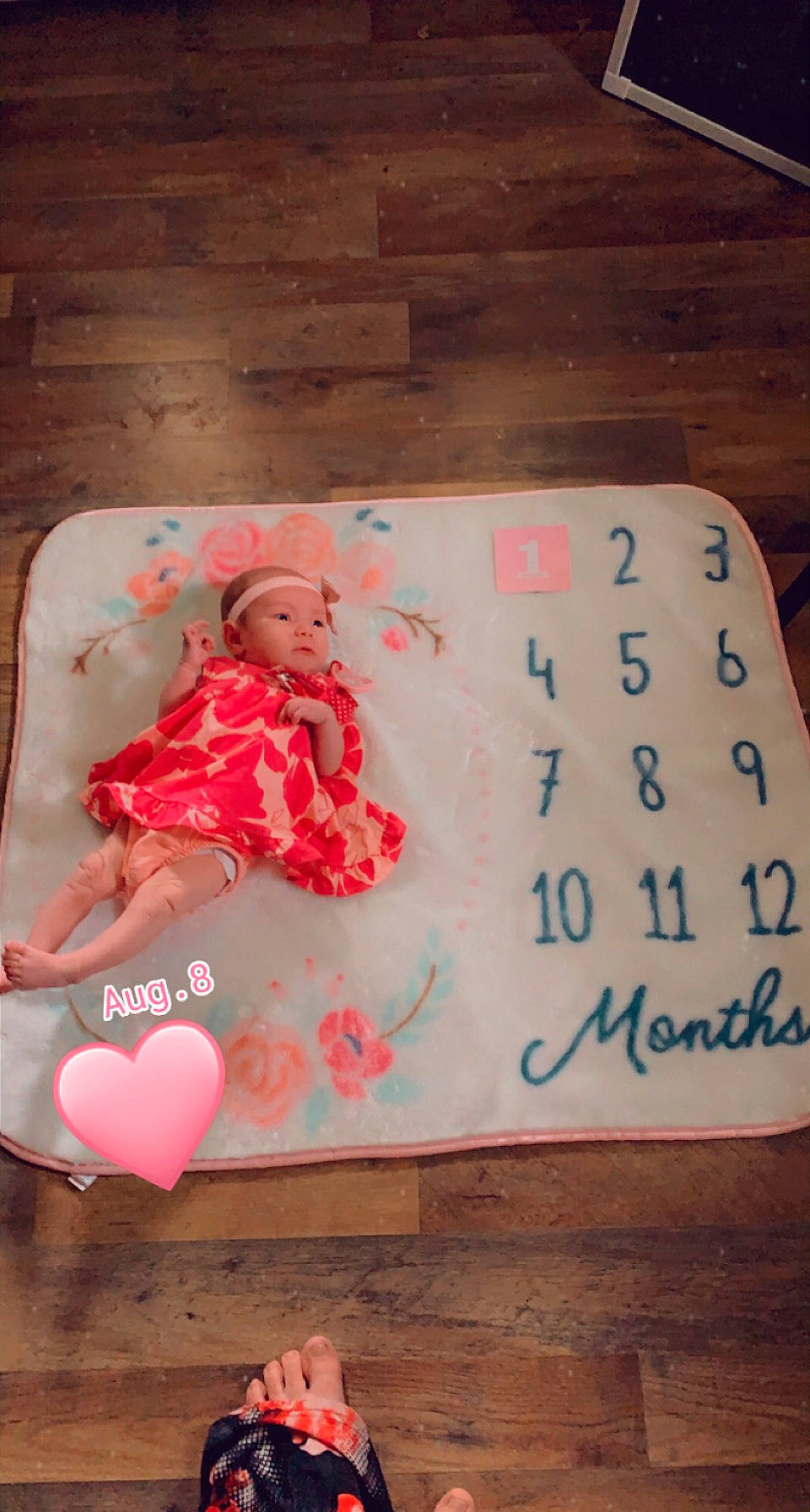 Theresa is registered to the contest to win money with this photo: baby, baby_toddler_clothing, carmine, child, flesh, flooring, font, handwriting, happy, hardwood, headwear, linens, magenta, pattern, peach, person, pink, rectangle, room, sweetness